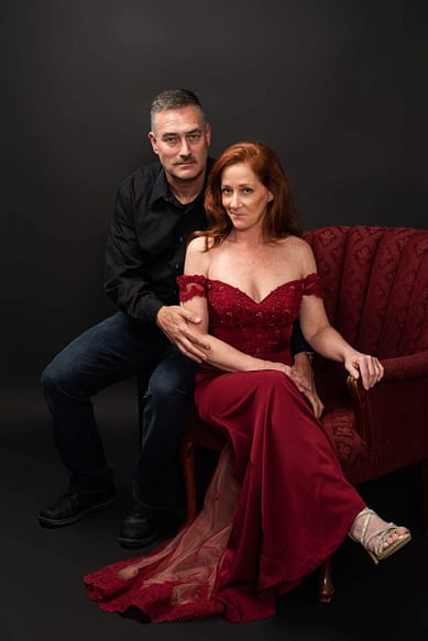 amy paris photography, couple sitting together, love campaign, red chair, red dress